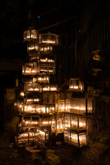 Glowing Hanukkah menorahs lit with small vials of oil burn in protective glass housing outside an apartment building in Jerusalem during the celebration of the Festival of Lights in Israel