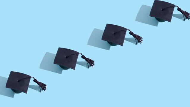 Moving graduated cap pattern. Education concept motion background. High quality 4k footage