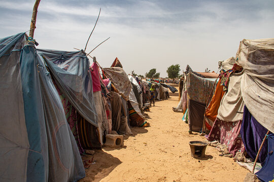 Refugee camp in Africa, full of people who took refuge due to insecurity and armed conflict. People living in very poor conditions, lack of food, clean water and proper shelter to stay in