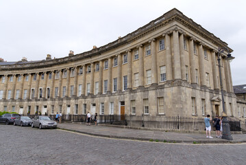 Fototapeta na wymiar The Royal Crescent is a row of 30 terraced houses at City of Bath on a cloudy summer day. Photo taken August 2nd, 2022, Bath, United Kingdom.