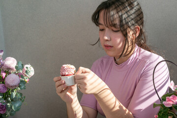 Girl eating birthday cupcake
