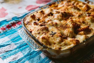 homemade oven baked pasta casserole with fresh cheese. Traditional italian dish 