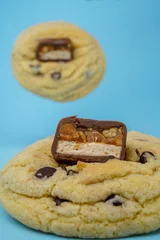 Zelfklevend Fotobehang Cookie and a chocolate bar, vertical © Nina Ljusic/Wirestock Creators