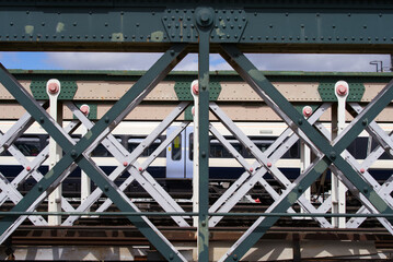 Close-up of Hungerford railway bridge with train in the background at City of Westminster on a...
