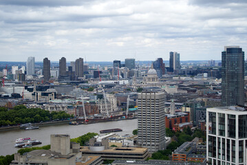Fototapeta na wymiar Aerial view of London with St Paul's Cathedral and Thames River on a cloudy summer day. Photo taken August 3rd, 2022, London, United Kingdom.