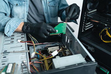 Close up of man hands repairing desktop computer. Pc repairing service concept