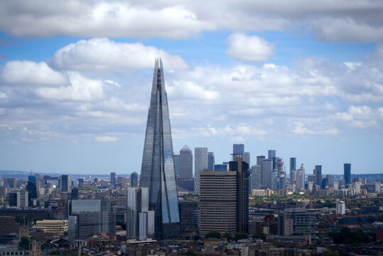 Aerial view of London with skyline and skyscraper The Shard on a cloudy summer day. Photo taken August 3rd, 2022, London, United Kingdom.