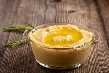 Chickpeas hummus with olive oil in the bowl.