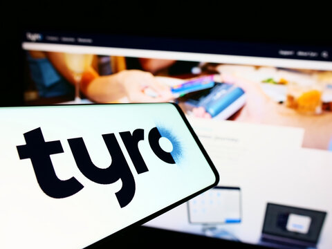 Stuttgart, Germany - 10-24-2022: Cellphone with logo of Australian fintech company Tyro Payments Limited on screen in front of business website. Focus on center of phone display.