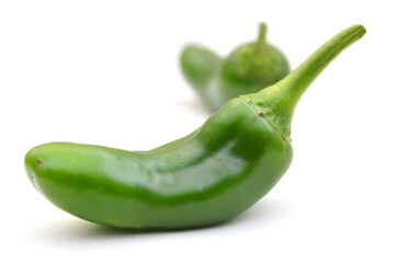 Green chilies (jalapeno) on white background 