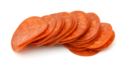 Slices of pepperoni on white background 