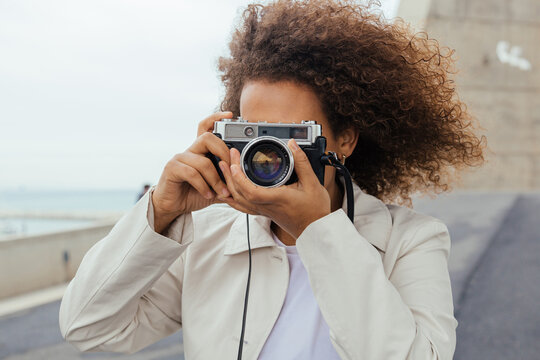 Black woman with photo camera