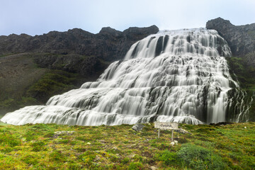 Obraz premium Dynjandi waterfall located in Arnarfjordur, Iceland. It is the largest waterfall in the Westfjords and has a total height of 100 metres. Below it are 5 other smaller waterfalls