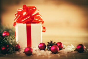 green fir branches on the wooden floor with gifts with Christmas