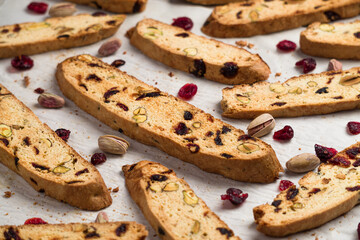 Biscotti cookies closeup made with cranberry and pistachio instead of almonds. Biscotti or cantucci are traditional italian baked sweet biscuits, popular during winter holidays as a snack or dessert