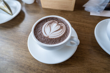 Coffee is in a clean white cup