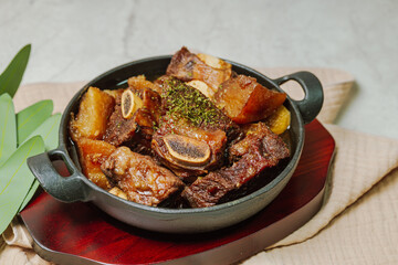galbijjim, Korean Braised Short Ribs : Beef short ribs, trimmed of fat, seasoned in sweet soy sauce, and braised until tender with carrots, chestnuts, ginko nuts, and other vegetables.