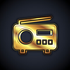 Gold Radio with antenna icon isolated on black background. Vector