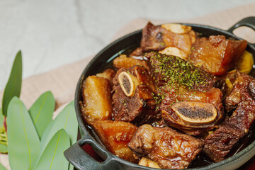 galbijjim, Korean Braised Short Ribs : Beef short ribs, trimmed of fat, seasoned in sweet soy sauce, and braised until tender with carrots, chestnuts, ginko nuts, and other vegetables.