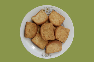 Toast Biscuits On Plate With Solid Background