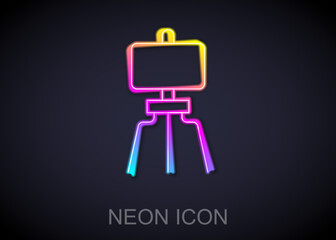 Glowing neon line Wood easel or painting art board icon isolated on black background. Vector