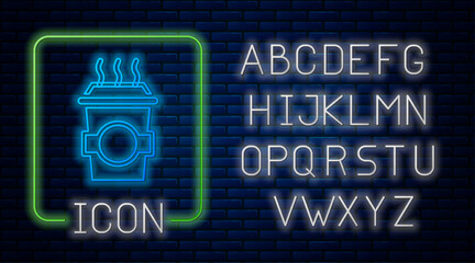 Glowing neon Coffee cup to go icon isolated on brick wall background. Neon light alphabet. Vector