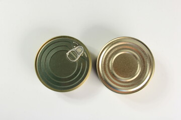 Many closed tin cans on white background. metal cans for fish and meat products