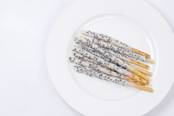 almond nut dark chocolate stick on white background 