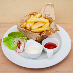 French fries with ketchup and mayonnaise