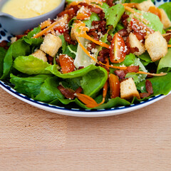 Fresh caesar salad with crispy bacon and crouton