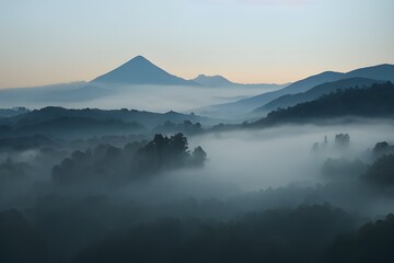 Mountains and valley blanketed in thick fog. 