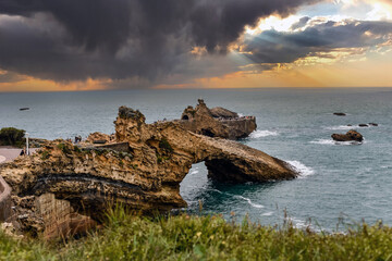 Landscape of the bay of Biarritz and its famous rock of the Virgin in the evening - obrazy, fototapety, plakaty