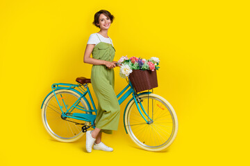 Full body photo of cute young lady girlish bicycle shopping promo 8 march dressed stylish khaki...
