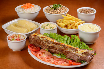 Sun meat and side dishes. Carne de sol, salted steak, typical dish from the Brazilian northeast.