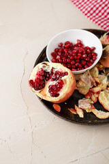 Close up of fresh red pomegranate fruit and seeds healthy food