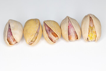 pistachios ready to eat on white background