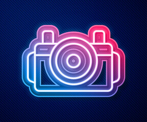 Glowing neon line Photo camera for diver icon isolated on blue background. Foto camera icon. Diving underwater equipment. Vector