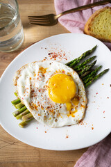 Grilled eggs with green asparagus. Healthy vegetarian food.