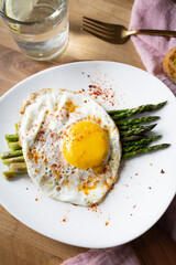 Grilled eggs with green asparagus. Healthy vegetarian food.