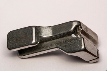 Sewing machine presser foot isolated on white background. Sewing machines, spare parts for sewing...