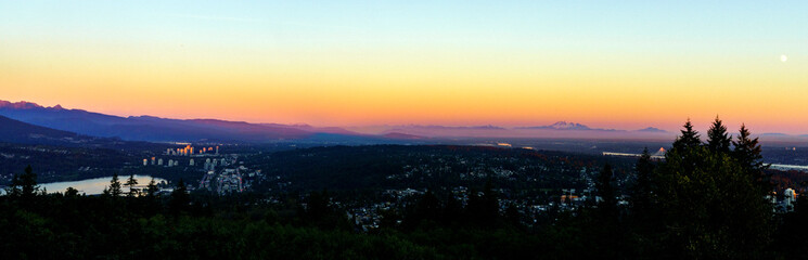 Fraser Valley sunset panorama with Mount Baker on horizon as viewed from a Burnaby Mountain residence.