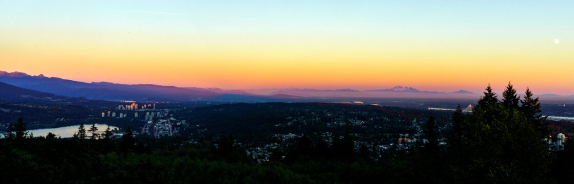 Fraser Valley sunset panorama with Mount Baker on horizon as viewed from a Burnaby Mountain residence. © Andrew