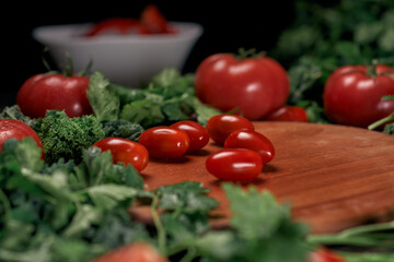 background image of tomatoes on a wooden kitchen board.