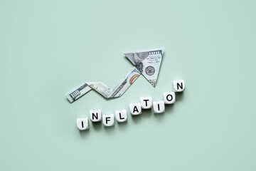 Inflation financial crisis concept. Growing up arrow from dollar banknote and word Inflation on...