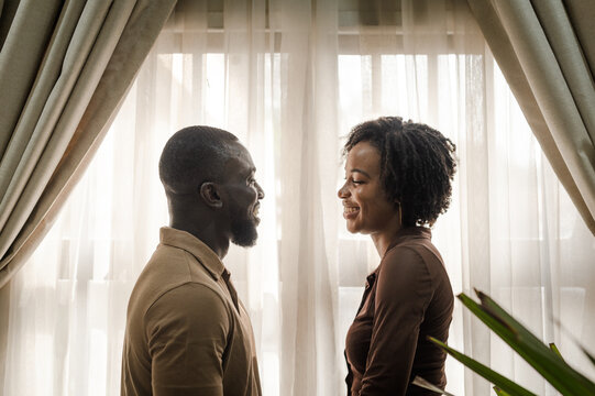 black couple smiling at each other