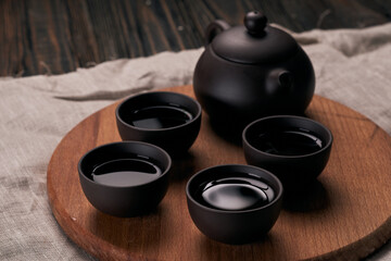chinese tea set on a wooden board.