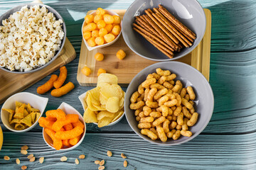 Beer salty snacks on wooden table