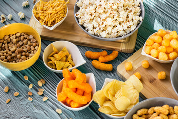Beer salty snacks on wooden table
