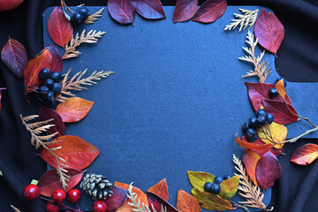 autumn leaf on wood black background (top view) leaf on old grunge wood deck, tablet for text,