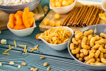 Beer salty snacks on wooden table
